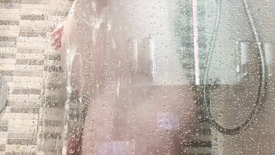 Amateur chubby lad is jerking his dick in the shower