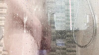 Amateur chubby lad is jerking his dick in the shower