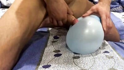 Straight bloke plays with his toy in front of the camera