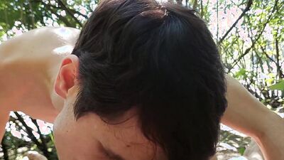 Young twink gets a tasty cumload from an older stranger at nude beach while public cruising