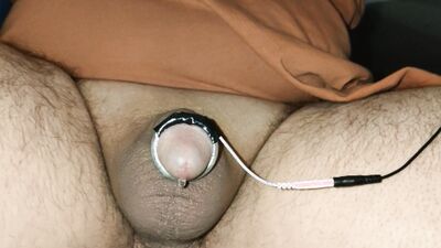 An e-stim session that ends in a fountain of cum