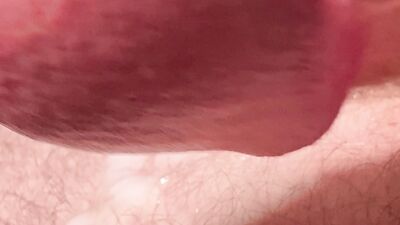 Close-up testicles massaging until big cumshot