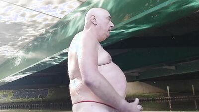 Fat pig Pascal masturbates in the humidity and mud under a bridge