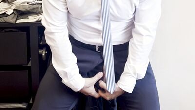 suited gentleman is spreading legs like slut and plays with his malepussy with locked dick