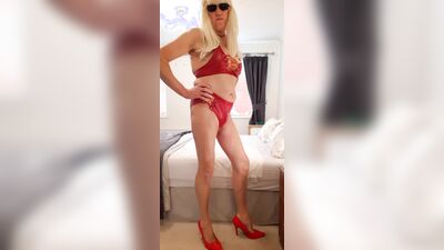 SISSY POSING IN RED LEATHER LOOK HOT PANTS