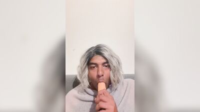 Crossdresser blows her dildo