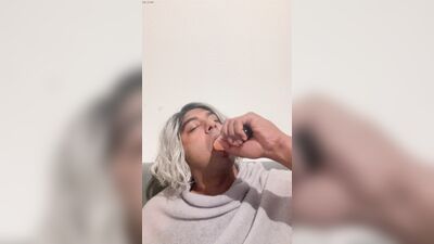 Crossdresser blows her dildo
