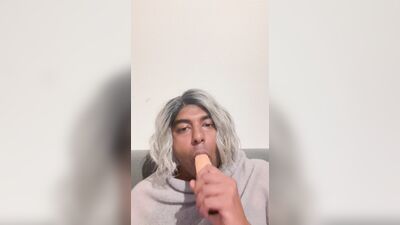 Crossdresser blows her dildo