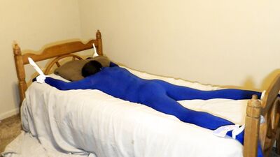 Gagged and Blindfolded tied to the bed with socks in a haunted house