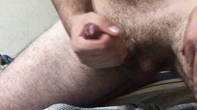 Hairy bisexual guy jerking off and moaning, cumming profusely and having an orgasm