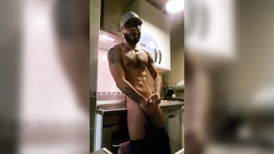 Muscular man has romantic sex in the kitchen