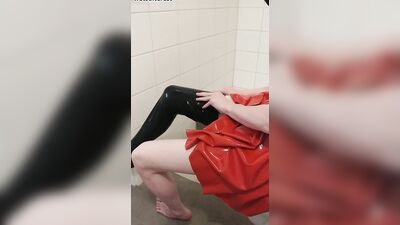 Dressing in red latex hooded swing dress and black rubber stockings