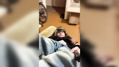 A guy in a jacket and a hat masturbates and cums upside down on his jacket