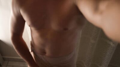 Muscular guy wanking after the shower