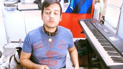 M a x x eats from a dog bowl in a dog collar