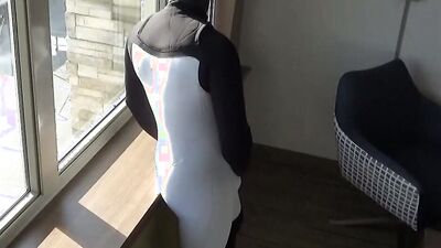 cumming inside wetsuit watching construction workers outside hotel