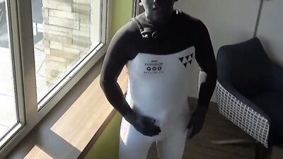 cumming inside wetsuit watching construction workers outside hotel