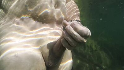 Very hot underwater jerking off in a dreamlike lake in the mountains