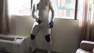 spandex & wetsuit at hotel window