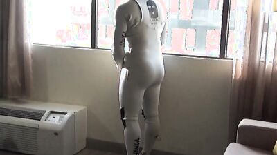 spandex & wetsuit at hotel window