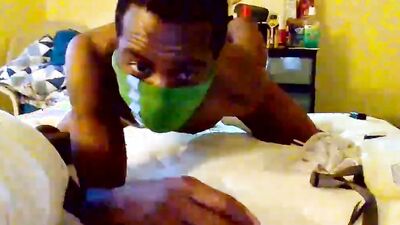 Masked lad plays with his ass in front of the camera