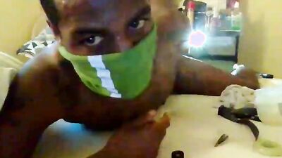 Masked lad plays with his ass in front of the camera