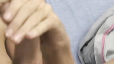 Skinny twink is stroking his dick in front of the camera