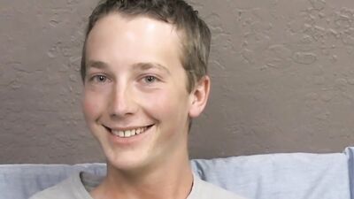 Skinny twink is stroking his dick in front of the camera