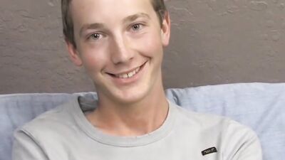 Skinny twink is stroking his dick in front of the camera