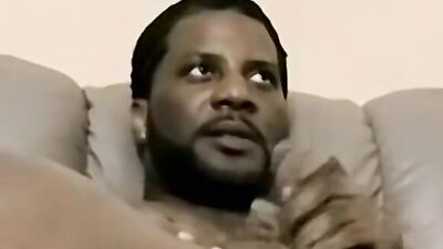 Amateur black fella is stroking his dong in front of the camera