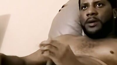 Amateur black fella is stroking his dong in front of the camera