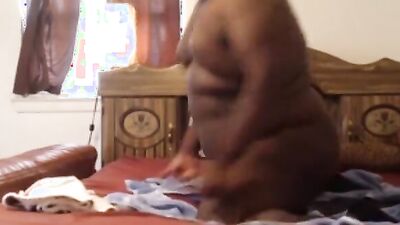 Fat black dude is shoving a dildo deep down his ass