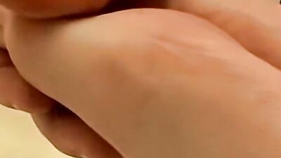 Guy plays with his feet and prick in front of the camera
