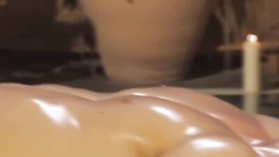 Oily bloke gets his prick stroked by a horny masseur