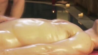 Oily bloke gets his prick stroked by a horny masseur