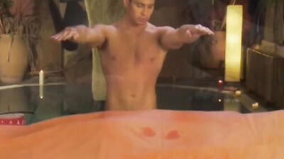 Oily bloke gets his prick stroked by a horny masseur