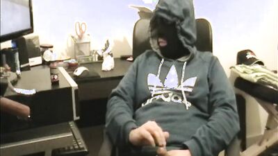 Masked dude is stroking his prick in front of the camera