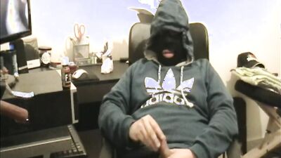 Masked dude is stroking his prick in front of the camera