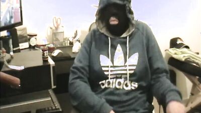 Masked dude is stroking his prick in front of the camera