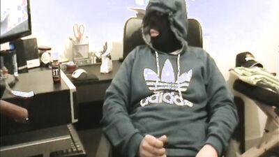 Masked dude is stroking his prick in front of the camera