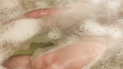 Amputee man bathes alone without hands and masturbates his big cock with his foot and stump