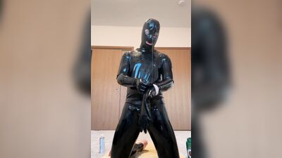 Lubing up with J lube getting into latex gimp suit gunge