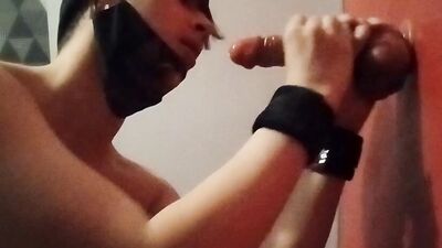 Handcuffed femboy suck a dildo with a chastity cage
