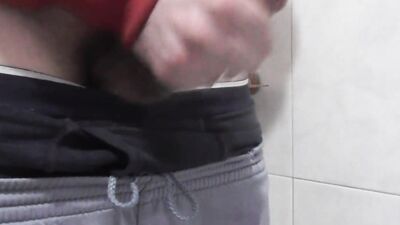 Big cumshot in a public bathroom