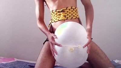 Fucking a glove balloon while wearing a rope corset. (DIY sextoy)