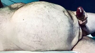 FAT DADDY STROKING HIS THICK UNCUT COCK ON THE COUCH