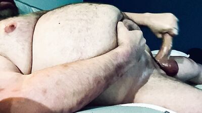 FAT DADDY STROKING HIS THICK UNCUT COCK ON THE COUCH