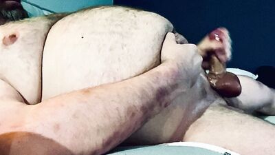 FAT DADDY STROKING HIS THICK UNCUT COCK ON THE COUCH