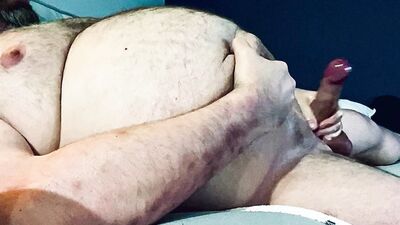 FAT DADDY STROKING HIS THICK UNCUT COCK ON THE COUCH