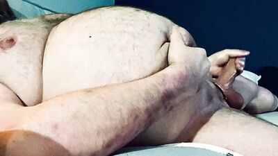 FAT DADDY STROKING HIS THICK UNCUT COCK ON THE COUCH